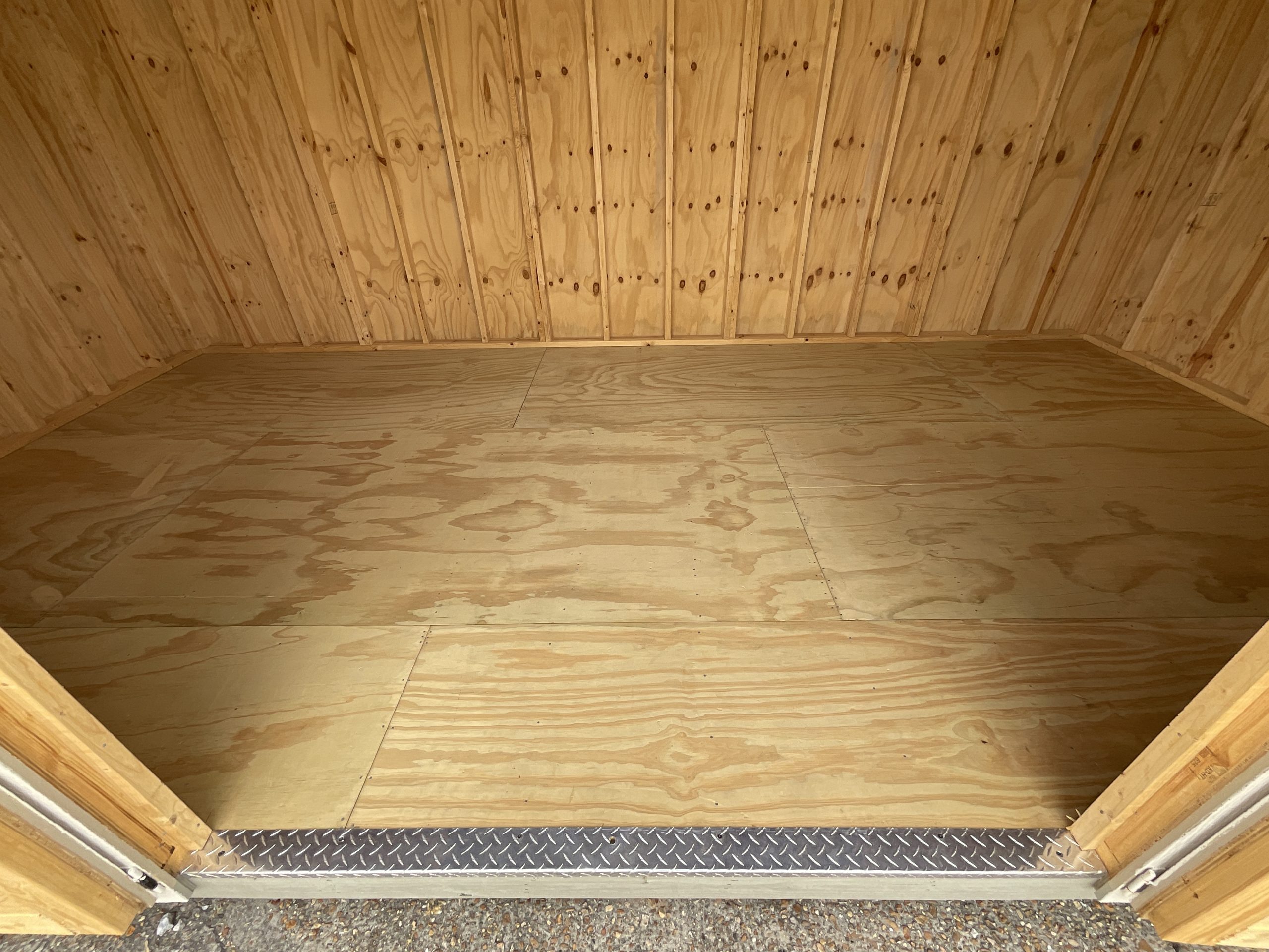 Floor surface inside portable barn building