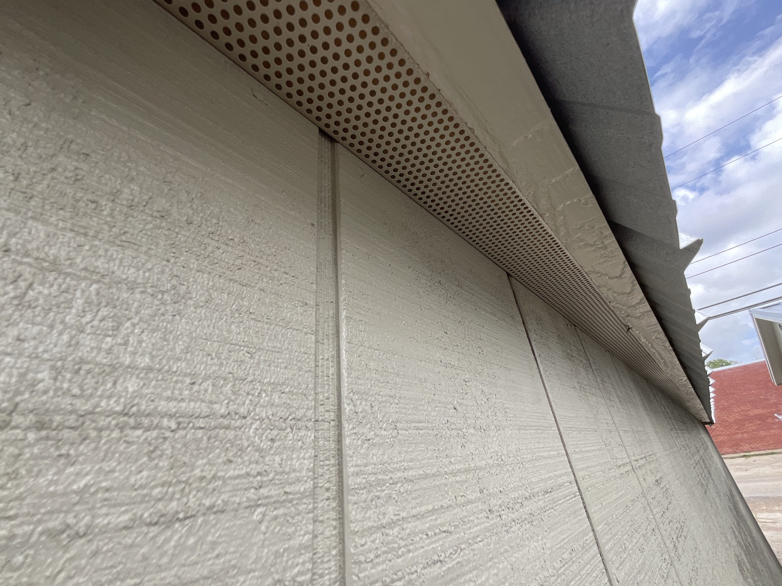 Soffit vent under roof overhang on side lofted barn in Hammond LA