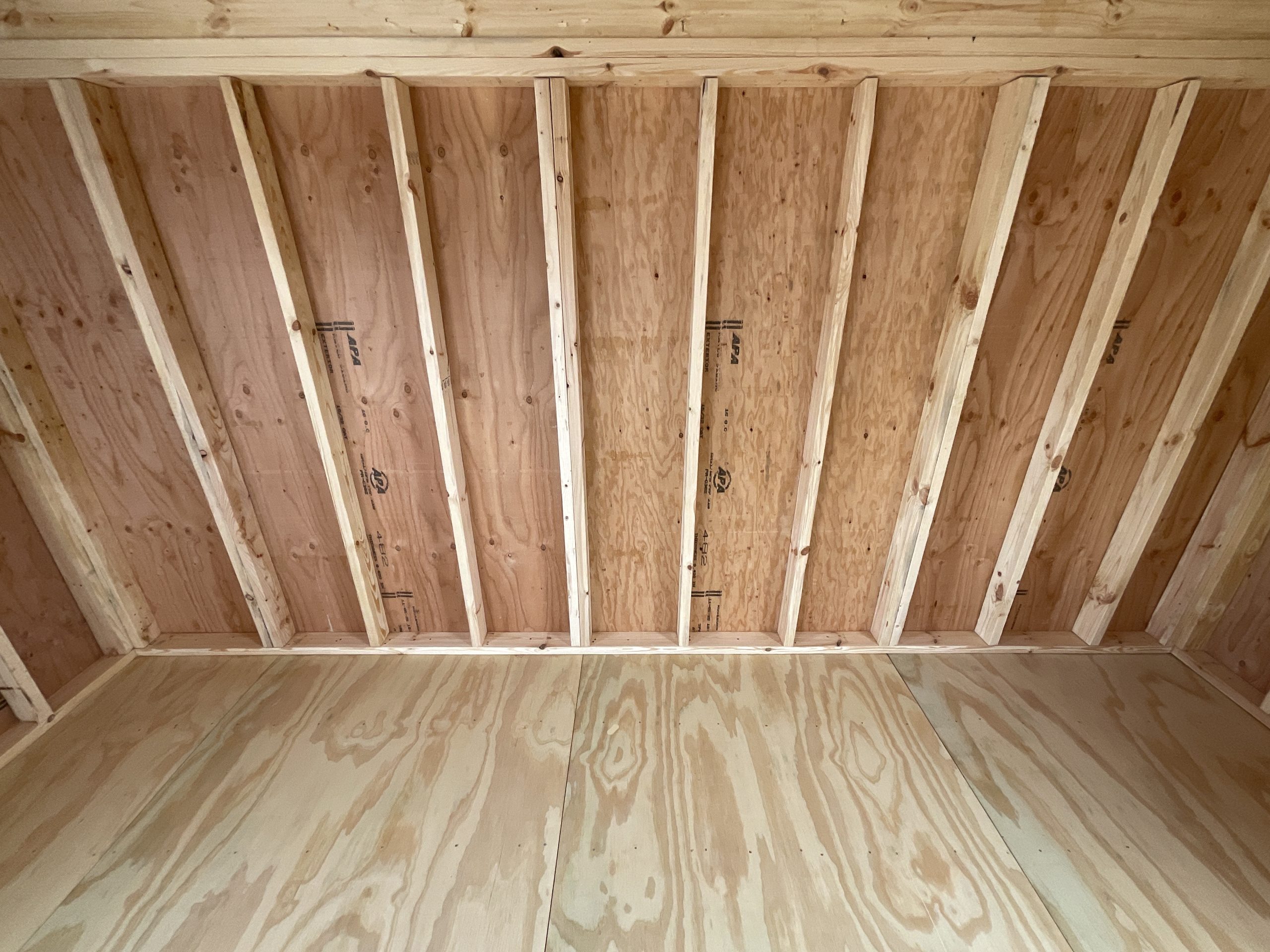 Real wood flooring and arauco wood siding inside lofted barn house shell Hammond LA