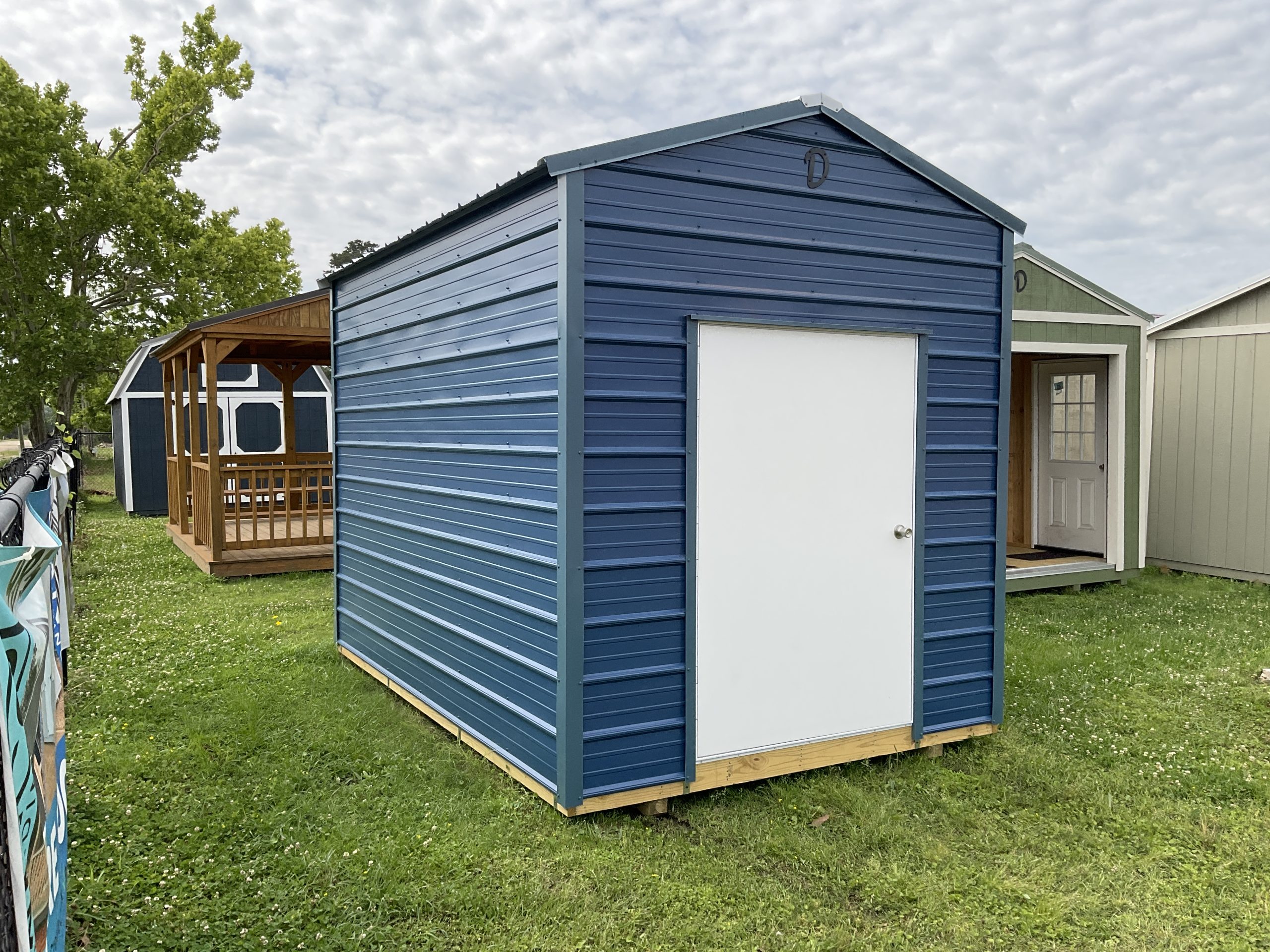8x12 metal shed for sale in Hammond Louisiana with blue siding and white door portable storage building