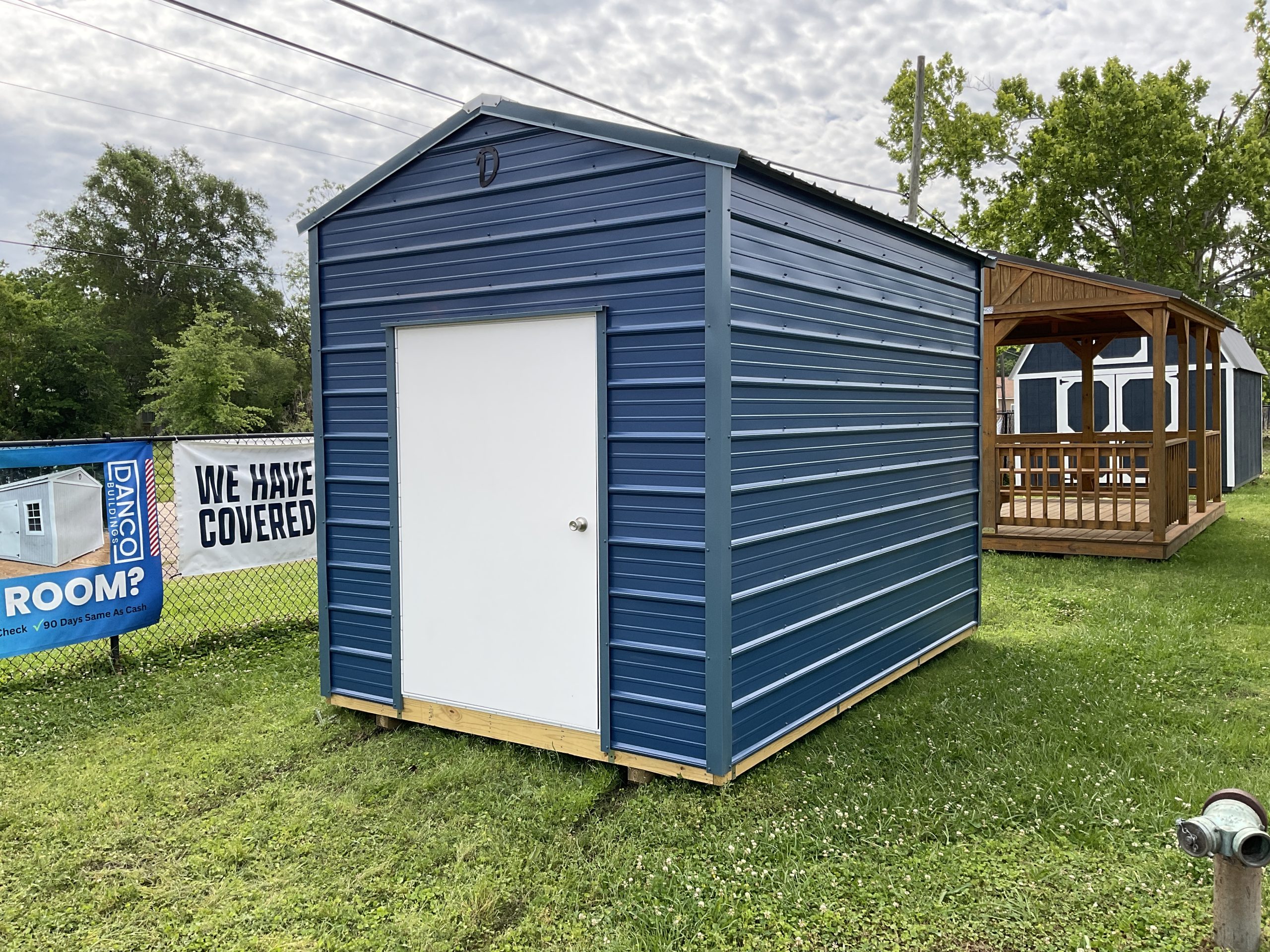 Affordable 8x12 storage shed for sale in Hammond LA metal building on display lot