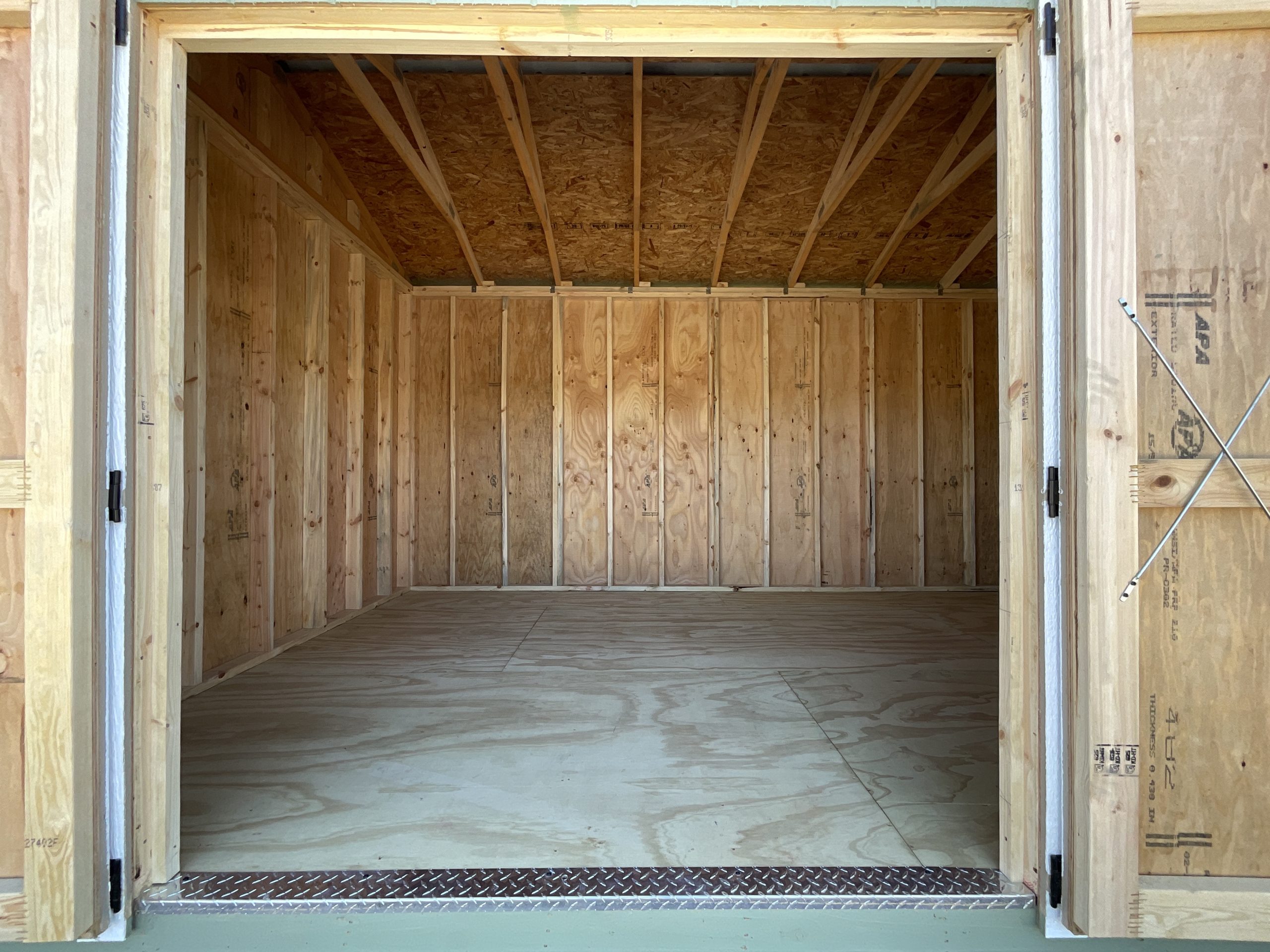 Interior of 10x16 Garden Shed Showing Real-Wood Flooring and Real-Wood Walls