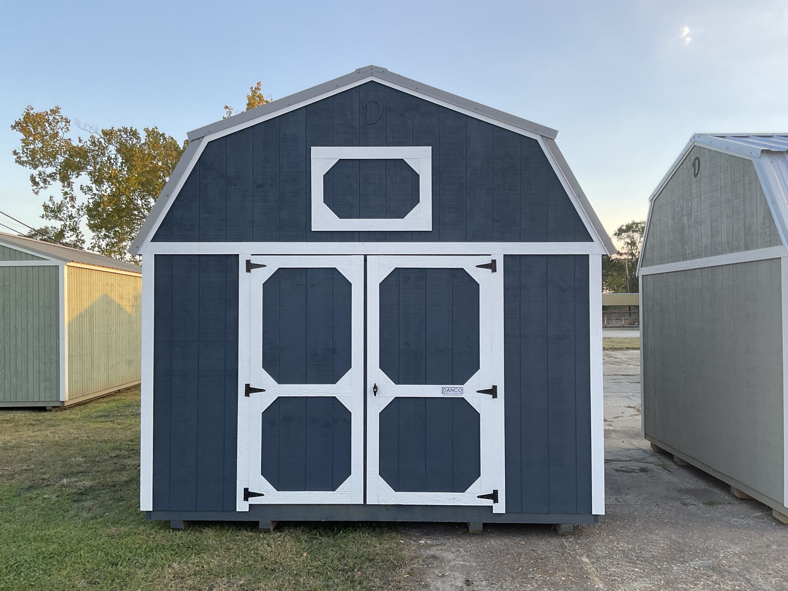 Front view of 12x16 lofted barn with double wood doors and loft storage in Hammond LA