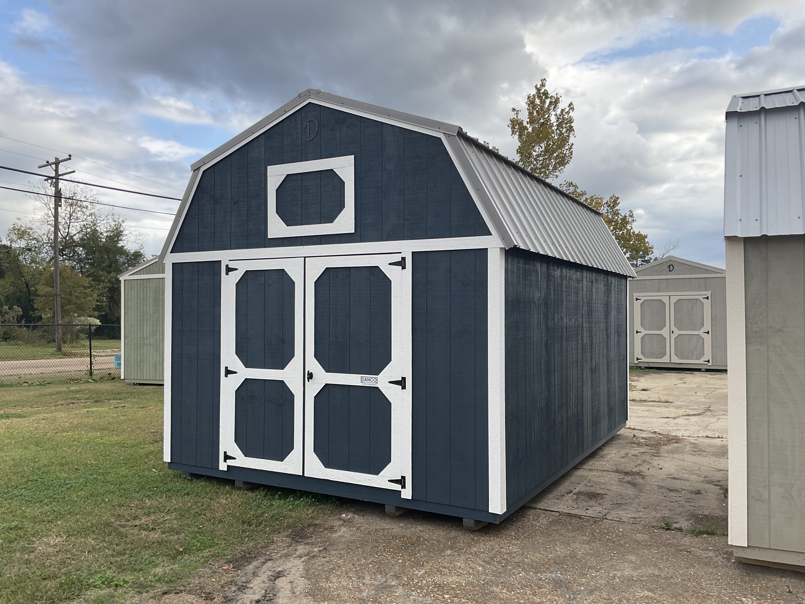 12x16 portable barn with real wood Arauco siding and metal roof in Hammond Louisiana