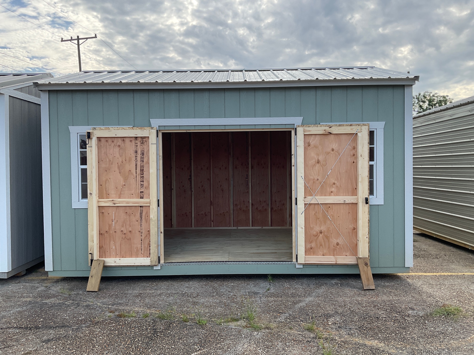 10x16 garden shed with both doors open showing spacious interior.