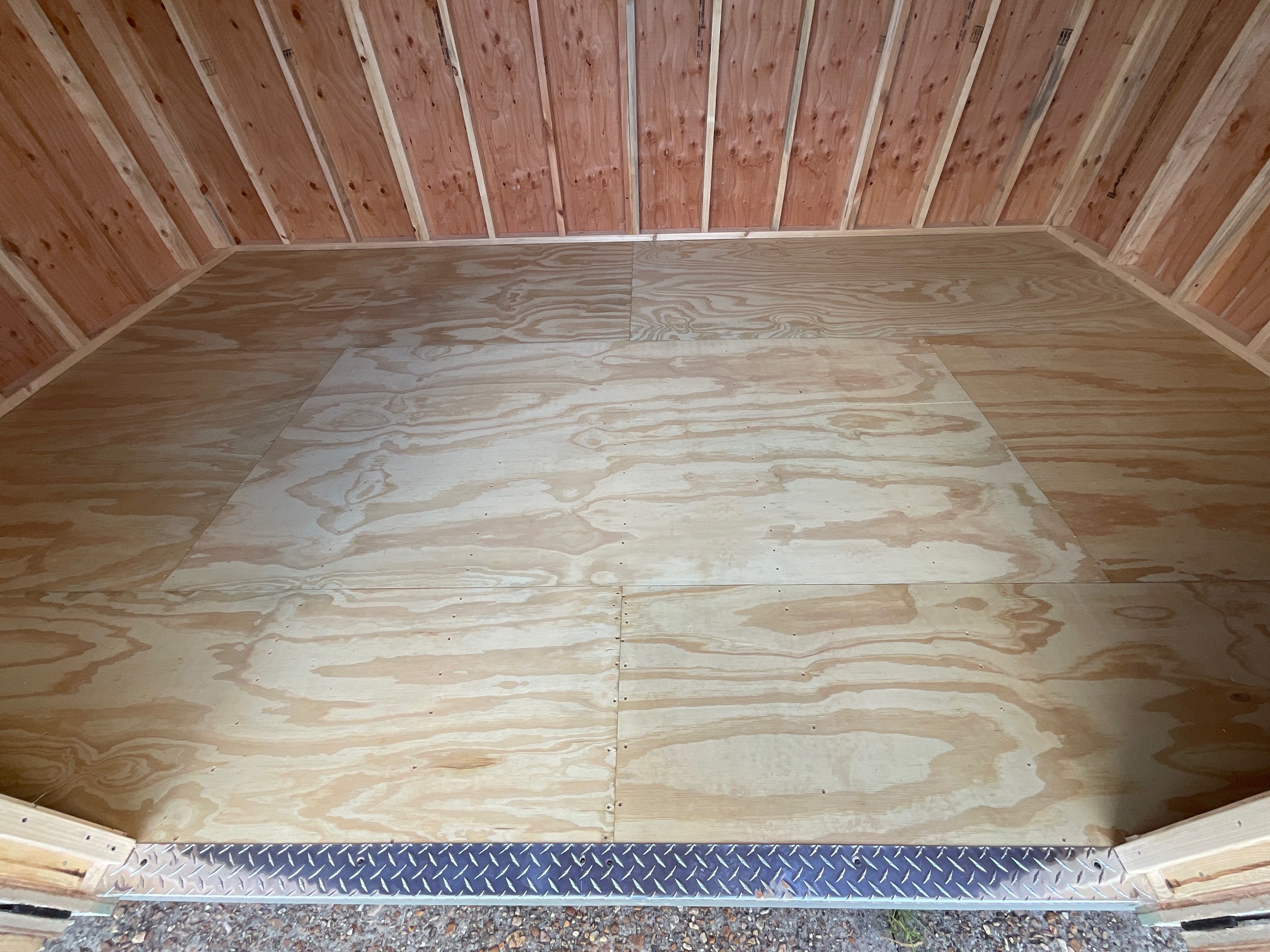 Real wood 5/8-inch tongue and groove flooring inside a premium storage building.