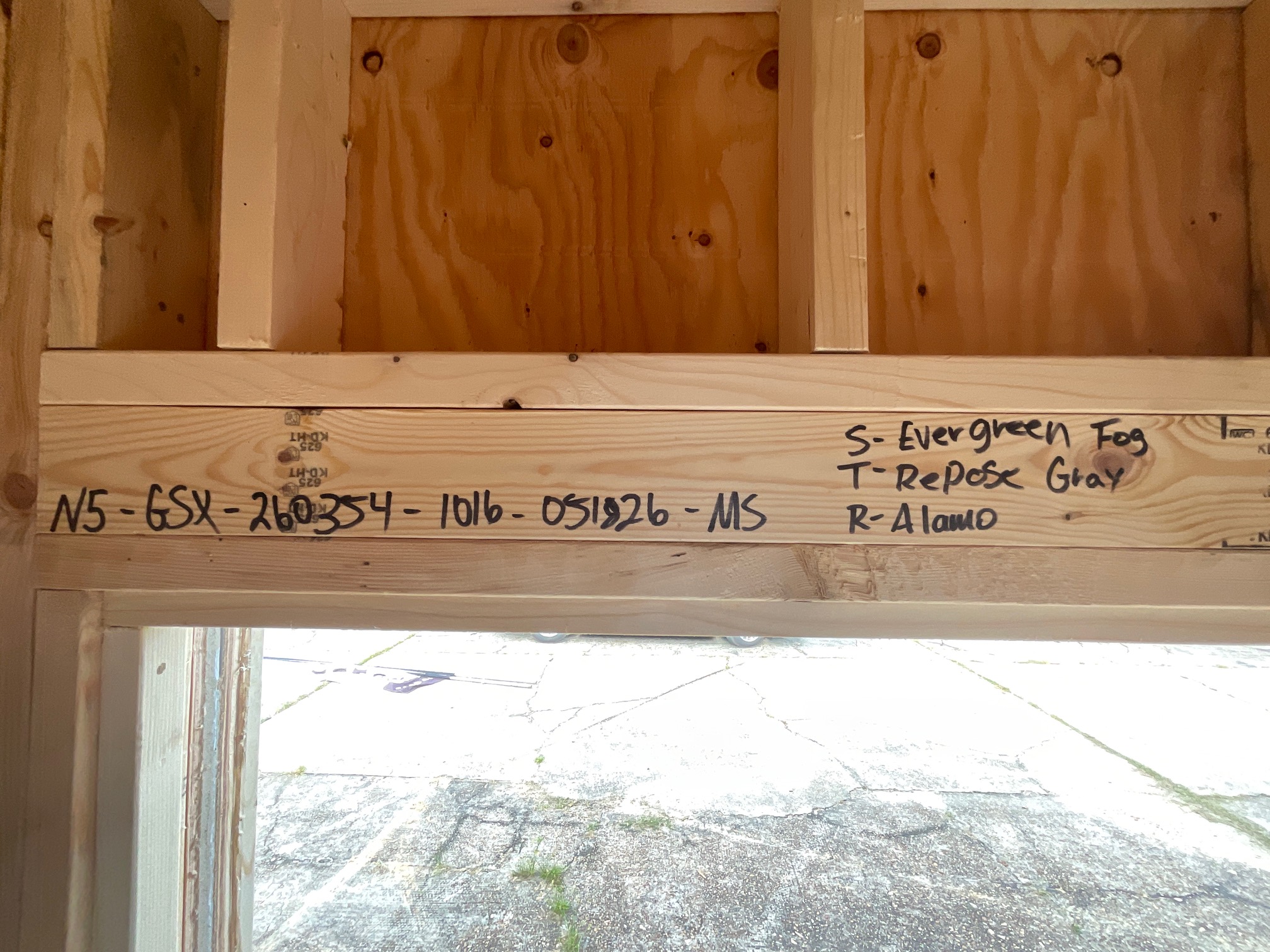 Heavy-duty structural header above the entry doors.