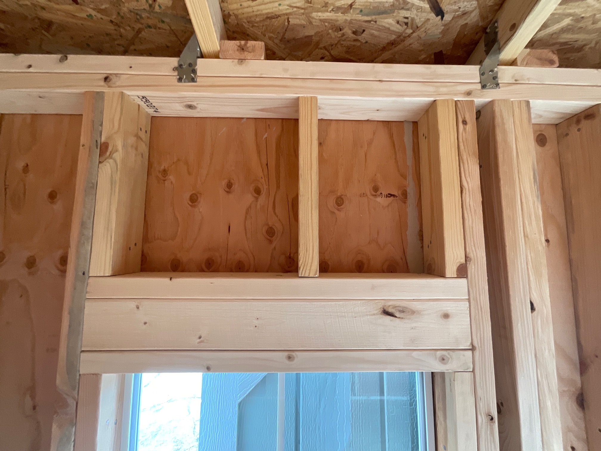 Beam-style header above the window like residential home construction.