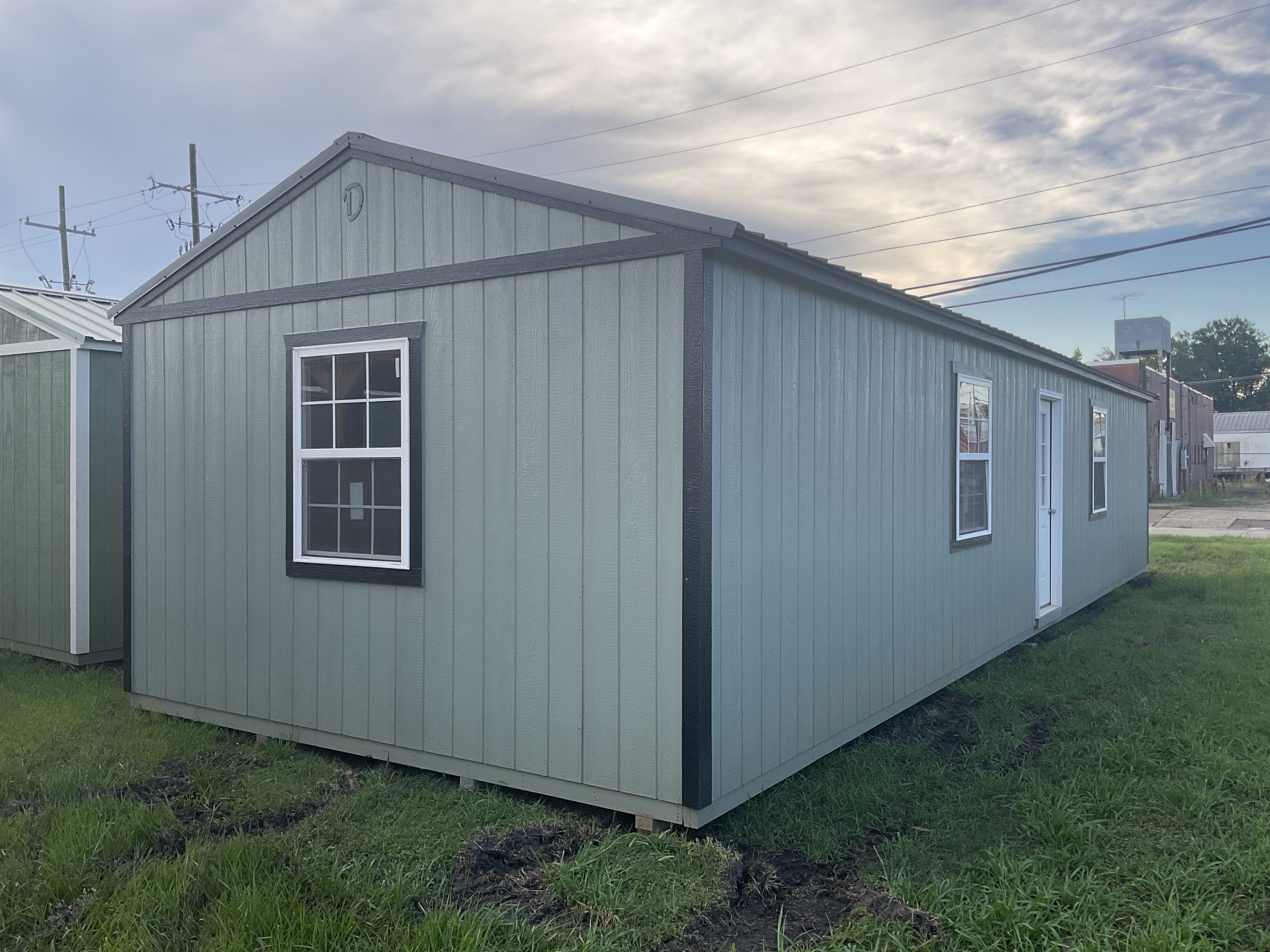 14x44 House Shell front left exterior with house door and double pane windows