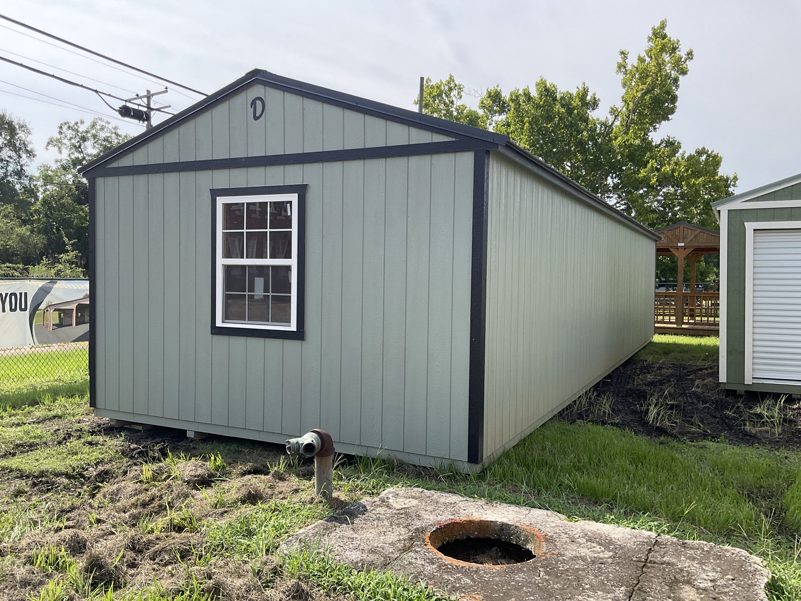 Rear exterior of 14x44 House Shell showing window placement