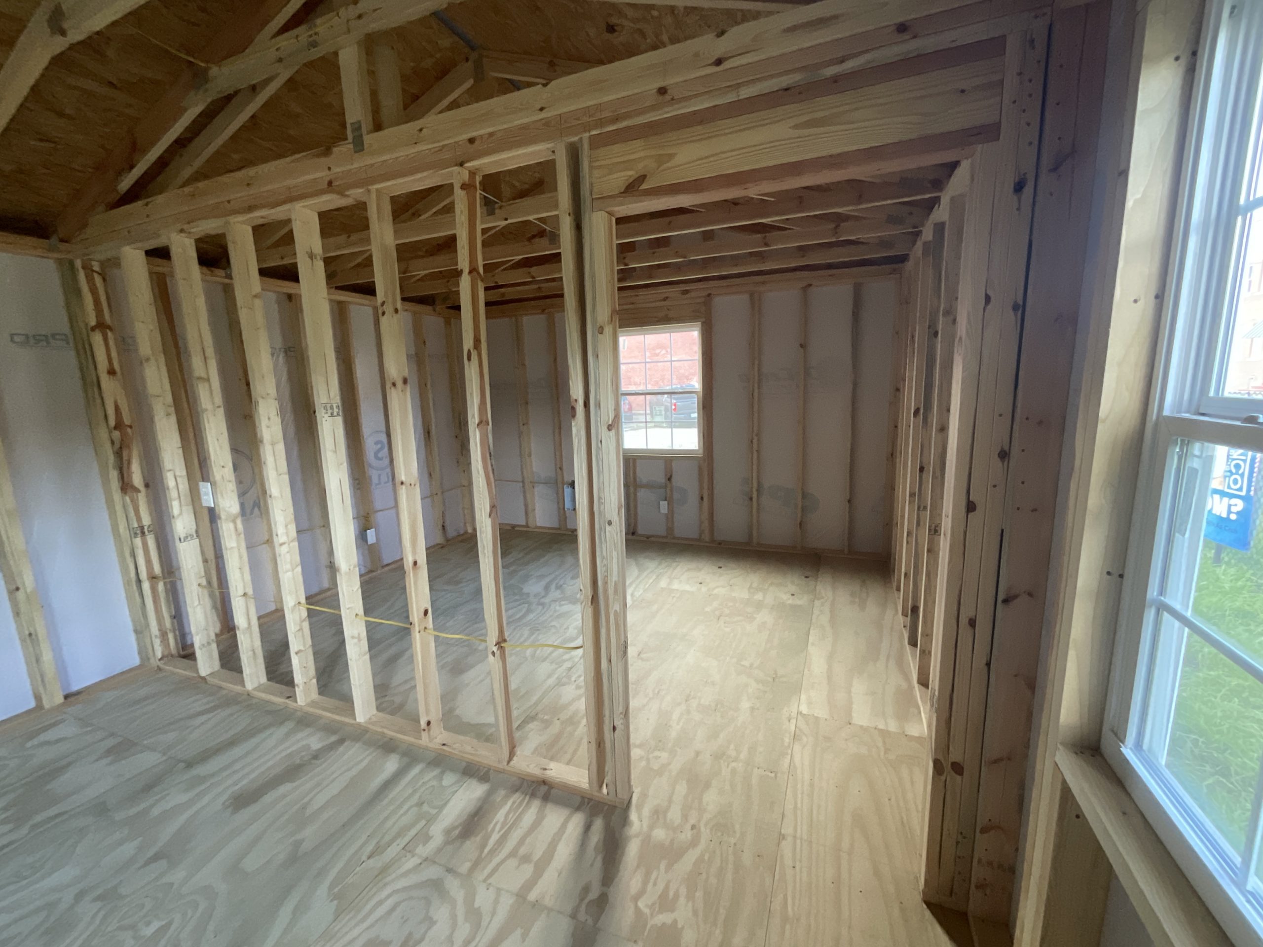 Framed primary bedroom inside House Shell