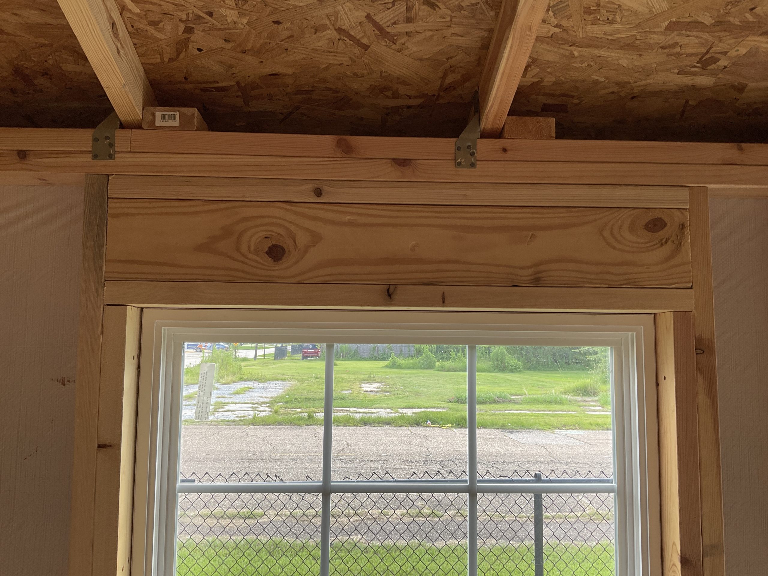 Heavy duty header above window in House Shell