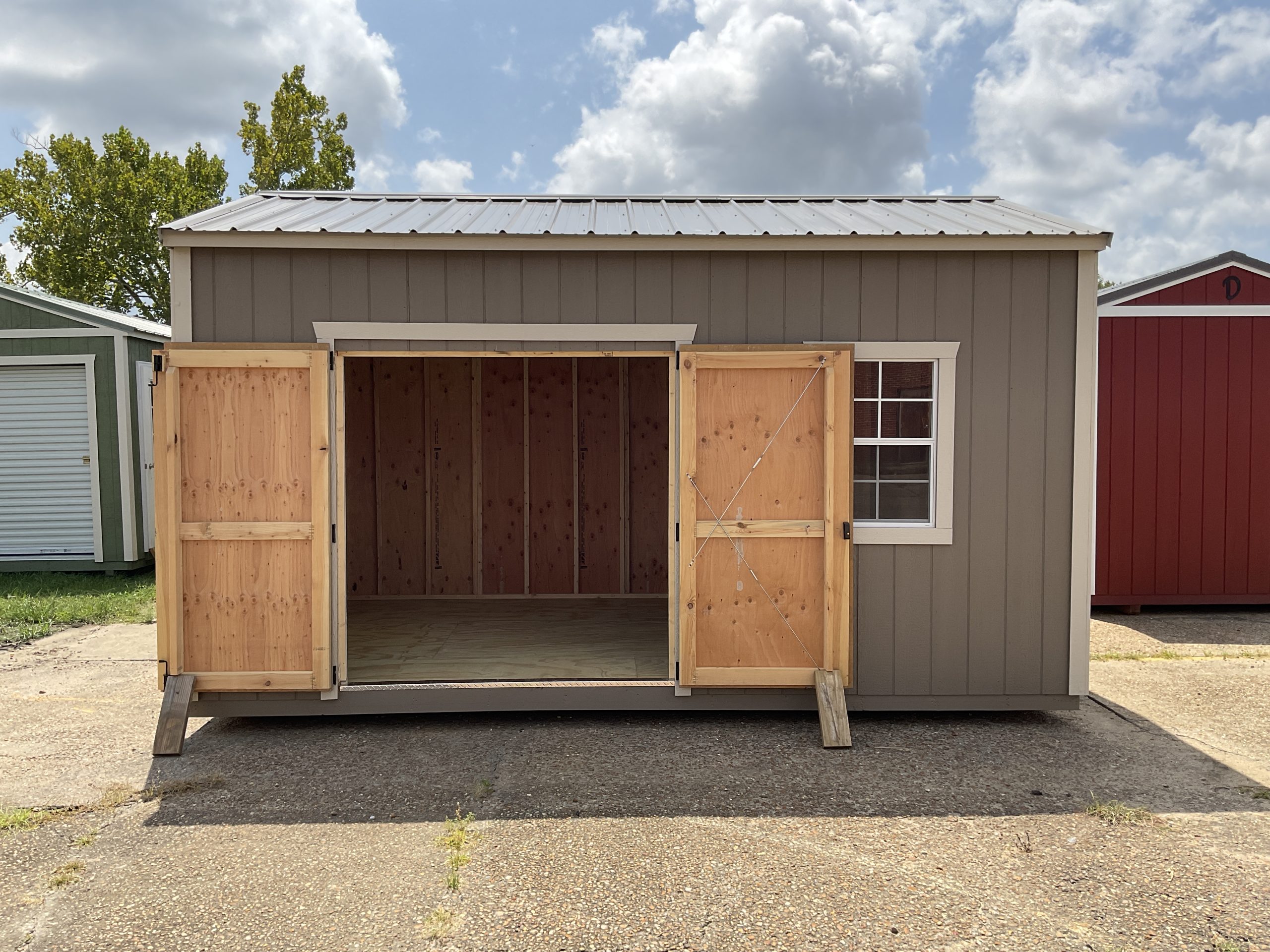 Open double wood doors on 10x16 DANCO Garden Shed in Hammond LA