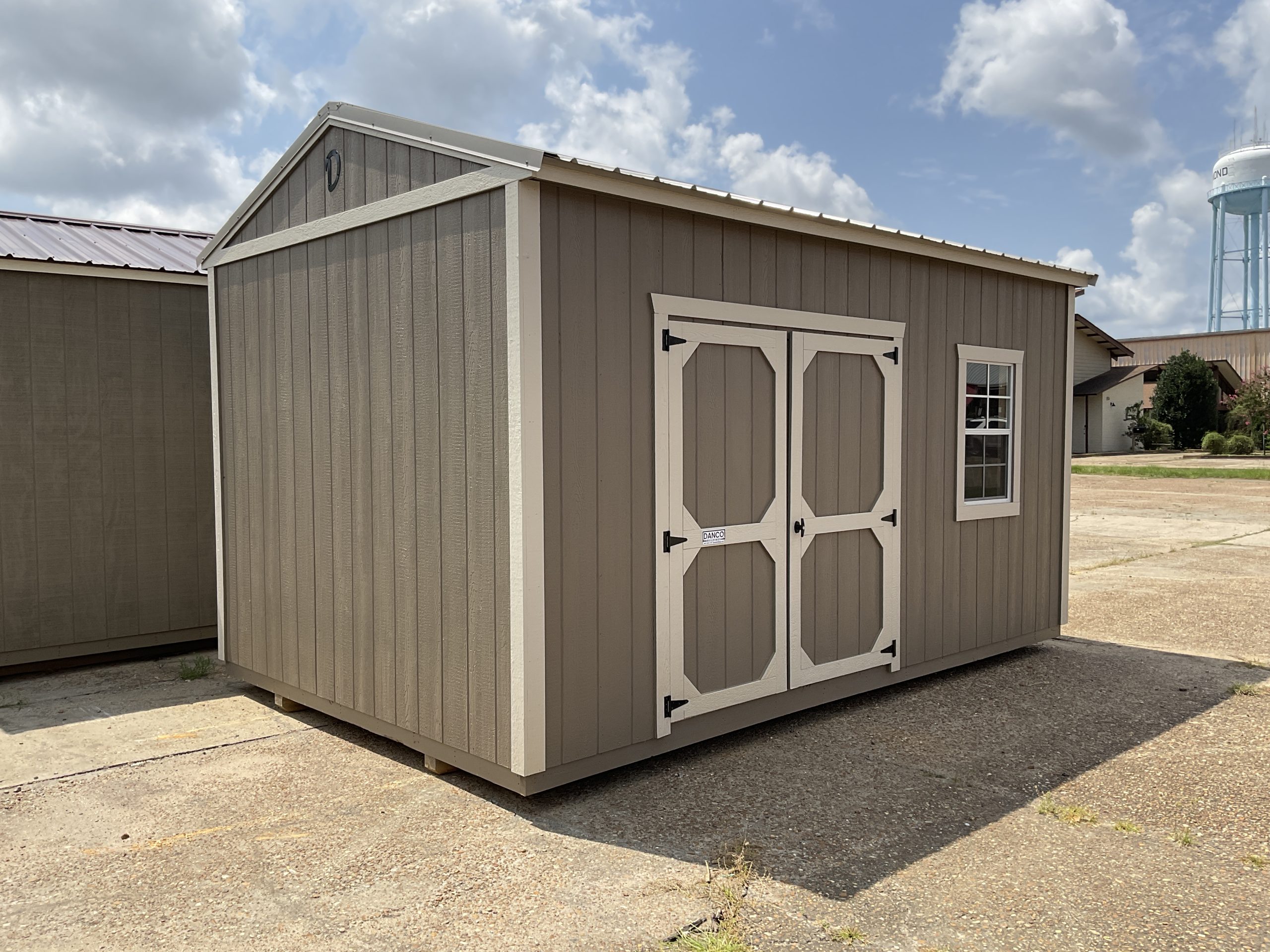 10x16 DANCO storage building with double wood doors and window in Hammond Louisiana
