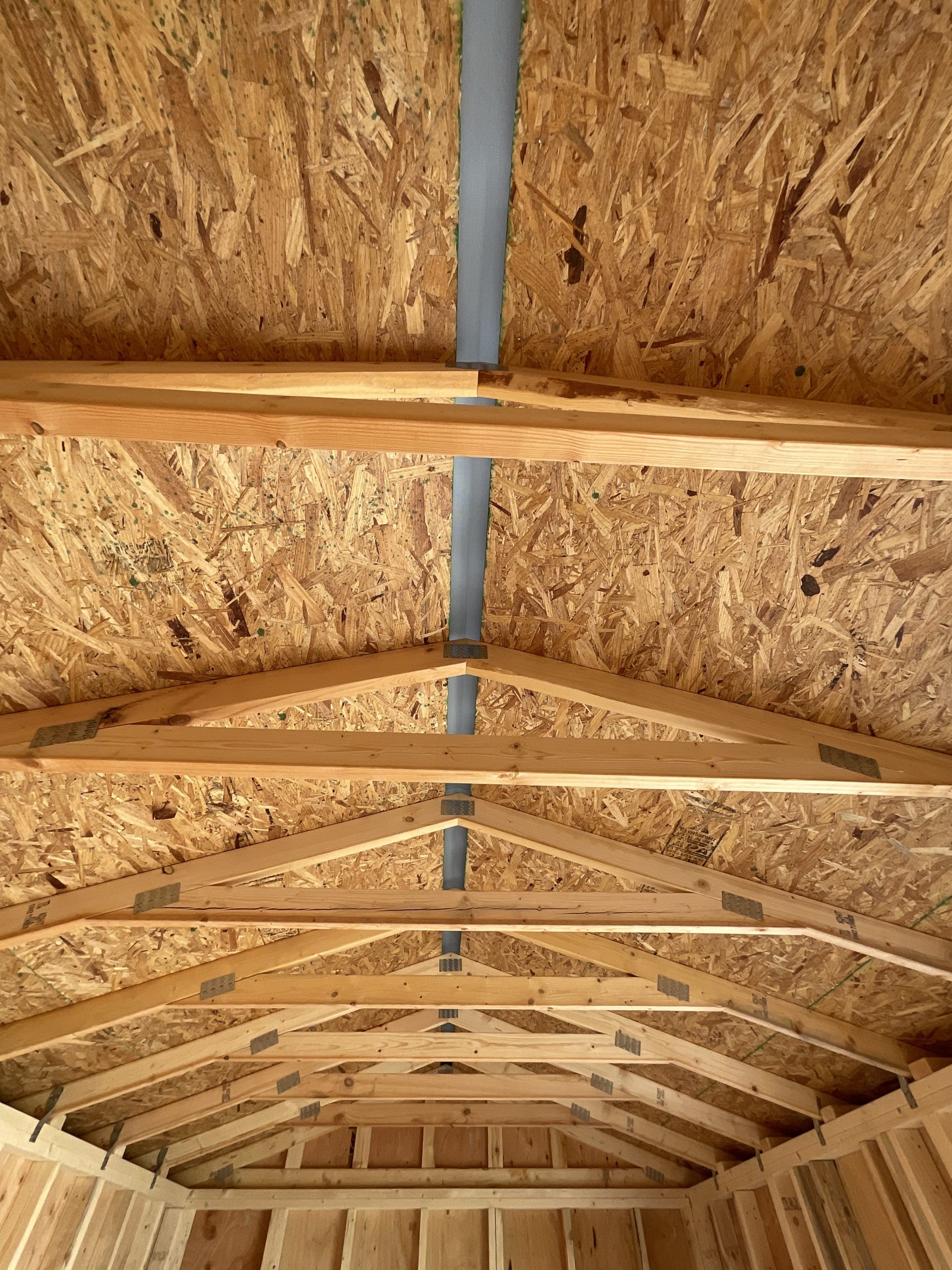 Engineered roof trusses and full-length ridge vent inside DANCO Garden Shed