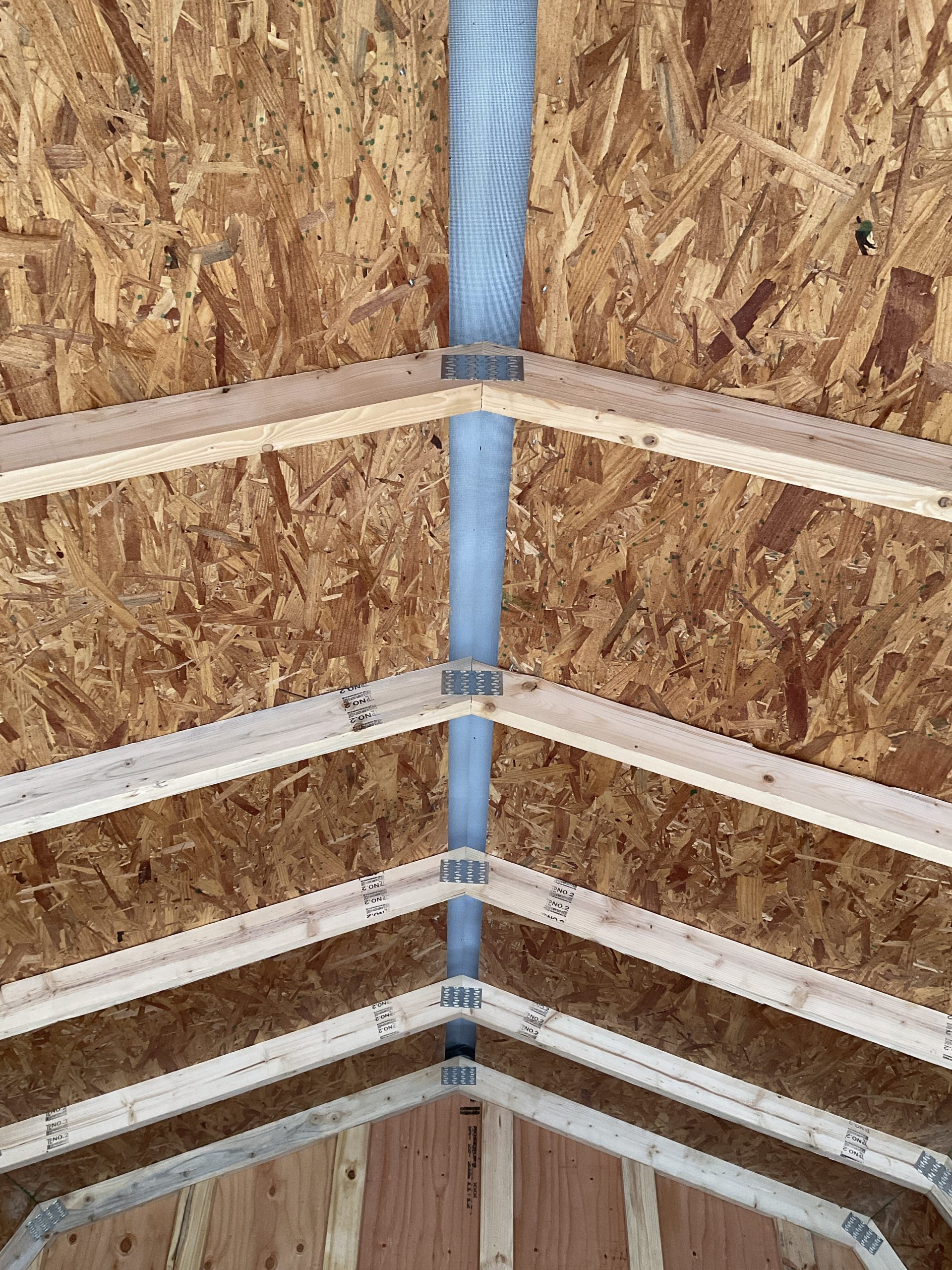 Full length ridge cap ventilation inside Lofted Barn metal roof