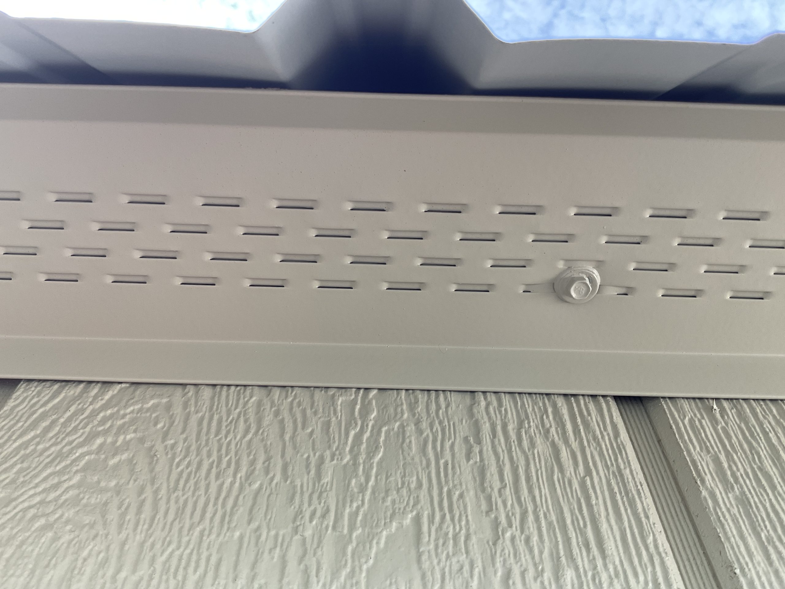 Full length ventilated soffit underneath Lofted Barn roof eave