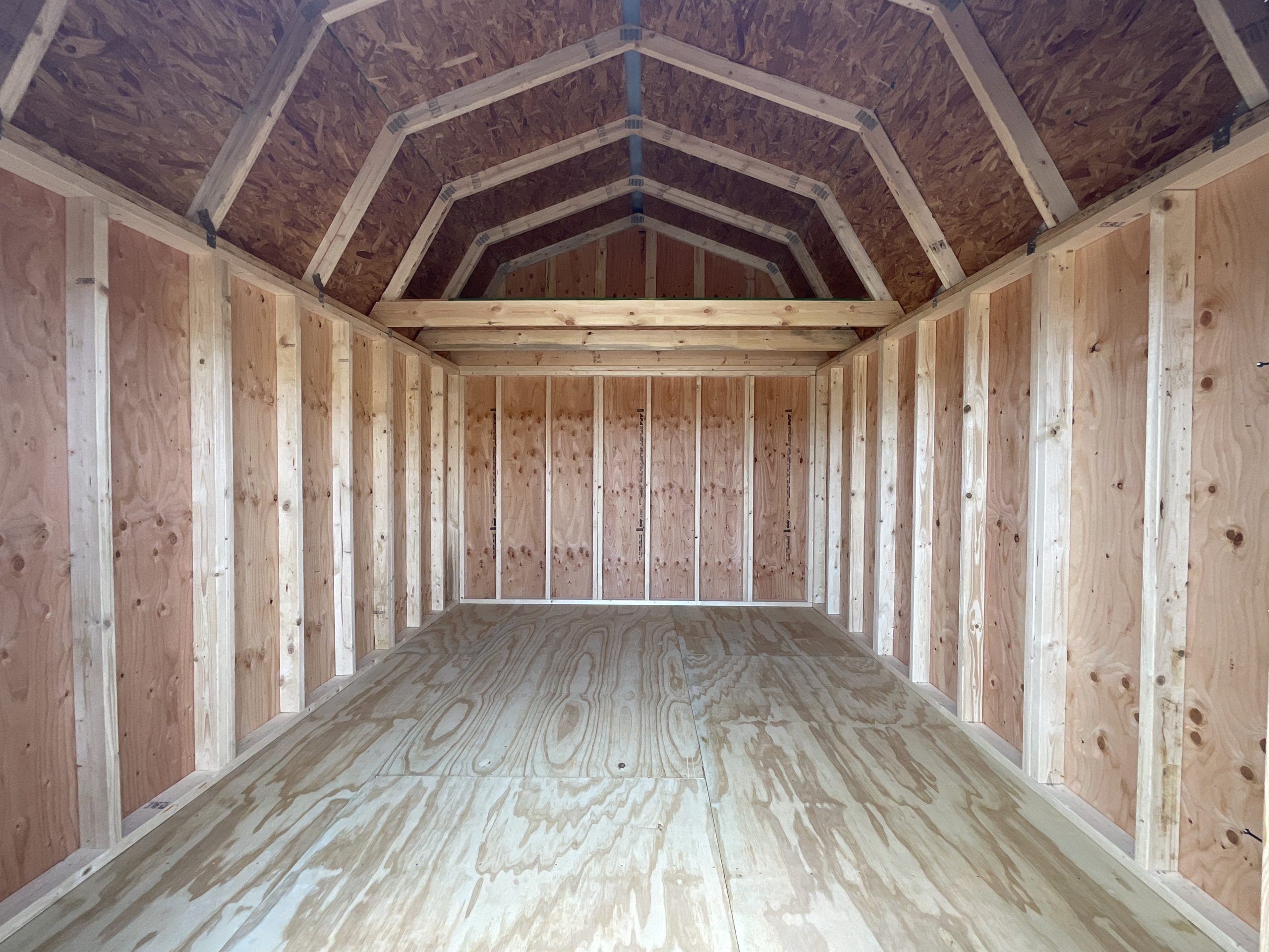 10x12 Lofted Barn interior with real wood floor siding and overhead loft